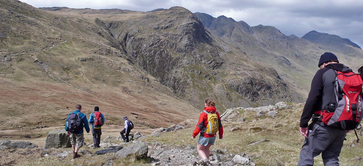 walkers with mountiainwise in the hills